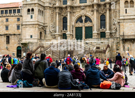 Pelegrins. Group of people praying in front of Cathedral Santiago de Compostela. Spain Stock Photo