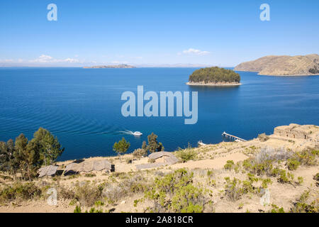 Scenic view from the Island of the Sun. Temple of the Sun ruins, Chillaca Island and Island of the Moon in the background, Lake Titicaca, Bolivia Stock Photo