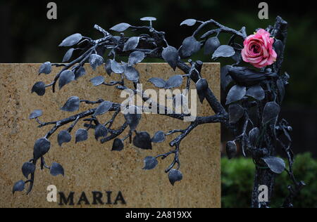 cemetery, rose on grave Stock Photo