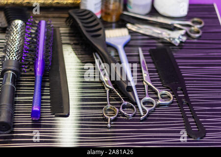 hairdresser tools. comb scissors and brushes laid out on the workspace  Stock Photo