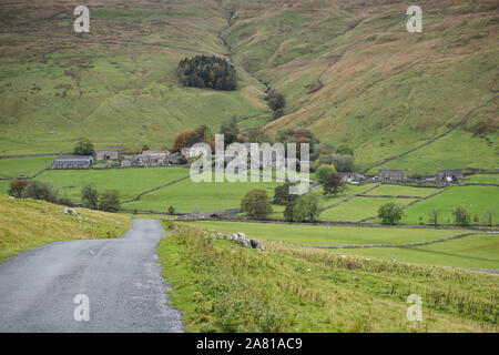 Road down to the picturesque village of Halton Gill nestling in the hillside, Yorkshire Dales