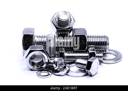 Metal screws and nuts in front of white background Stock Photo