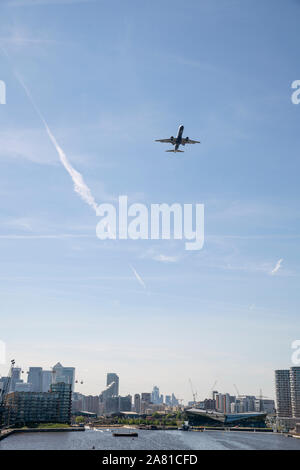 Planes flying over the city of London, England Stock Photo
