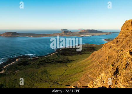 View from Lanzarote onto La Graciosa island at sunset Stock Photo