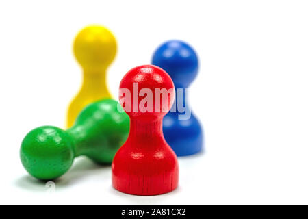 Colourful wooden play figures in front of a white background Stock Photo