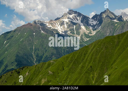 Green slopes of Caucasus mountain range in Upper Svaneti, Georgia. Beautiful summer high mountain landscape.