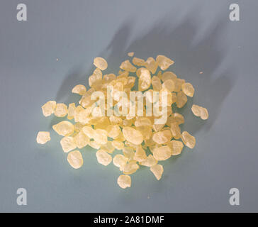 Mastic resin tears. Chios mastic on blue grey background, top view Stock Photo