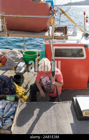 Small Fishing Boat With Fishing Equipment Anchored In Calm Waters Stock 