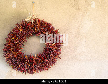 A New Mexico-style wreath made of dried red chiles Stock Photo