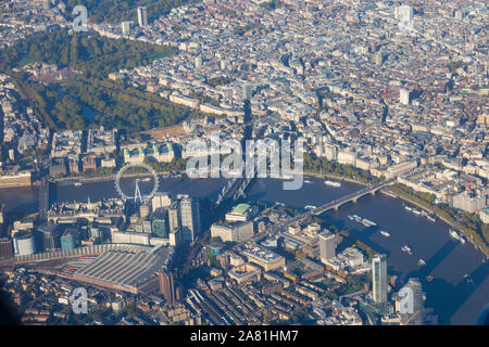 Aerial view over London with The Coca Cola London Eye, River Thames, Waterloo station, Charing Cross station, Buckingham Palace. England. UK Stock Photo