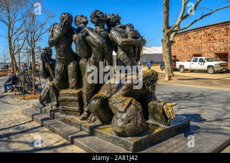 Bronze Statue Migrants, The Immigrants by Luis Sanguino, Battery Park, Lower Manhattan, New York City, New York, USA Stock Photo