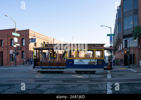 SAN FRANCISCO - February 08, 2019: Cable car on San Francisco streets. It’s the world's last manually operated cable car system and is the icon of the Stock Photo