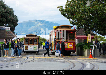 SAN FRANCISCO - February 08, 2019: Cable car on San Francisco streets. It’s the world's last manually operated cable car system and is the icon of the Stock Photo