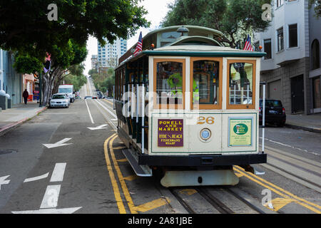 SAN FRANCISCO - February 08, 2019: Cable car on San Francisco streets. It’s the world's last manually operated cable car system and is the icon of the Stock Photo