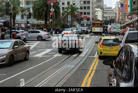 SAN FRANCISCO - February 08, 2019: Cable car on San Francisco streets. It’s the world's last manually operated cable car system and is the icon of the Stock Photo