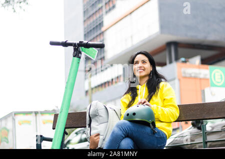 Portrait of cycling woman holding biking protective helmet ready for workout Stock Photo