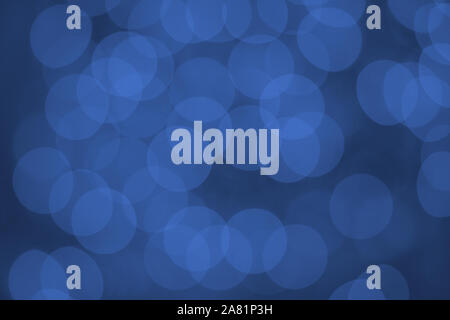 Beautiful abstract lights on blue backdrop. Blurred, bokeh, defocused. Stock Photo