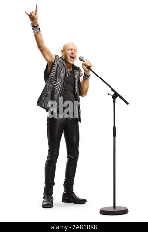 Bald punk rocker singing on a microphone and playing a guitar isolated ...