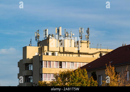Telecommunication telecom masts antennas on roof of student accomodation of University of Sopron, Hungary Stock Photo