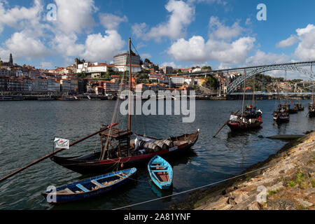 Porto, Portugal - July 26, 2019: Scenic view of the city of Porto,  with traditional rabelo boats at the Douro River, the Ribeira neighborhood and the Stock Photo