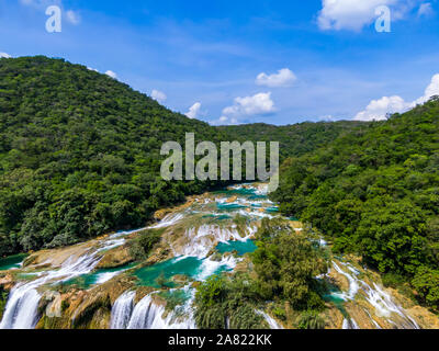 Aerial drone shot of the water fall Tamul in San Luis Potosi Mexico, water fall from a drone, green water fall, beautiful waterfall,Tamul water fall.
