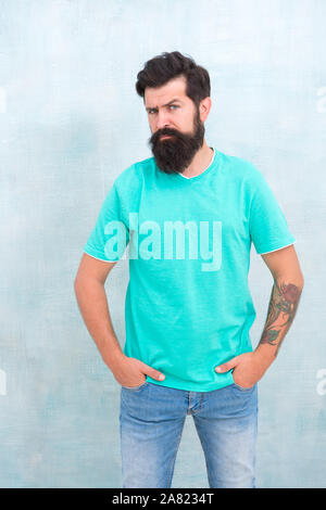 Hair care. Find best beard design shape for facial hair. Bearded hipster brutal guy. Having nice beard is distinguishable style that exuberant professionalism and manhood. Taking care of facial hair Stock Photo - Hair care. Find best beard design shape for facial hair. Bearded hipster brutal guy. Having nice beard is distinguishable style that exuberant professionalism and manhood. Taking care of facial hair Stock Photo -