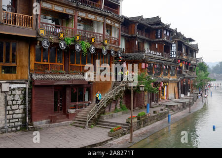 Tourist town Fengshuan Ancient City offers Old World charm alongside the homes and businesses that sit on the edge of the Tuo Jiang River in Tibet, Ch Stock Photo