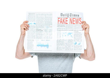 man reading newspaper with fake news, isolated on white Stock Photo