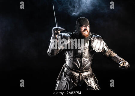 Angry medieval knight armor with a sword and shield, black and white ...