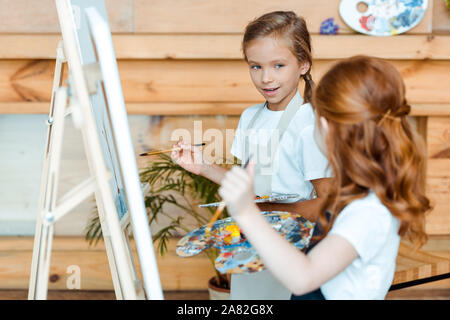 Happy Redhead Kid Painting Canvas Art School Stock Photo by ©AndrewLozovyi  315124082