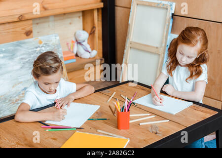 cute children drawing on papers in art school Stock Photo