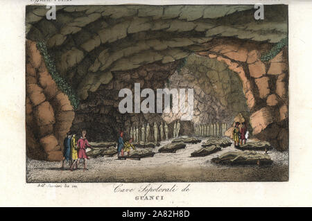 Sepulchral cave with mummies of the Guanche (aboriginal Berber) people on the Canary Islands. Handcoloured copperplate engraving by Andrea Bernieri from Giulio Ferrario's Ancient and Modern Costumes of all the Peoples of the World, Florence, Italy, 1843. Stock Photo