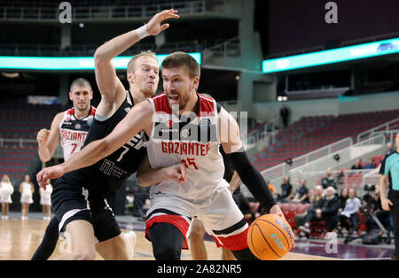 Riga, Latvia. 5th Nov, 2019. Roberts Freimanis (L, front) of VEF Riga vies with Ivan Buva of Gaziantep Basketbol during the group C match at Europe Basketball Champions League in Riga, Latvia, on Nov. 5, 2019. Credit: Edijs Palens/Xinhua/Alamy Live News Stock Photo