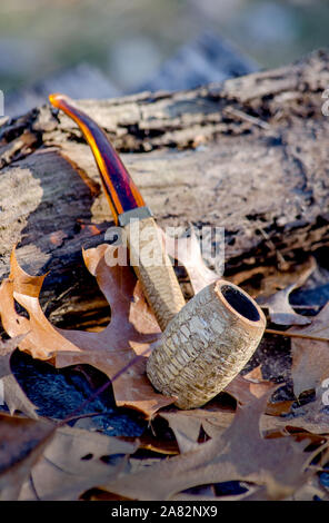 corncob pipe outdoors on a rustic backdrop Stock Photo