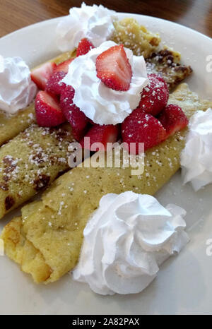 strawberry crepes with whipped cream Stock Photo