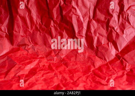 crumpled red paper makes an interesting background Stock Photo