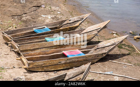 Three cayucos or fishing boats on the shore of Lake Atitilan at San Antonio Palopo, Guatemala. Stock Photo