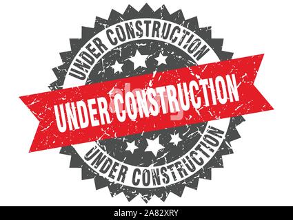 under construction grunge stamp with red band. under construction Stock Vector