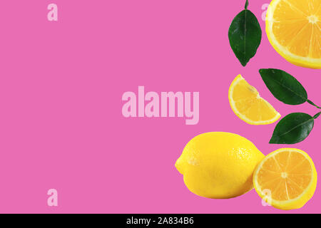 Fresh ripe lemons isolated on pink background. Top view with copy space for text. Stock Photo