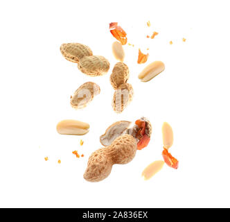 Falling peanuts on white background Stock Photo