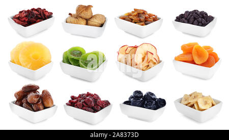 Bowls with different dried fruits on white background Stock Photo