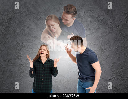 Quarreling young couple dreaming about making peace on grey background Stock Photo