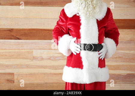 Santa Claus on wooden background Stock Photo