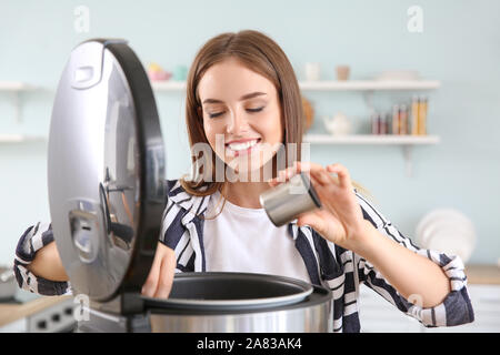 Woman using modern multi cooker in kitchen Stock Photo - Alamy