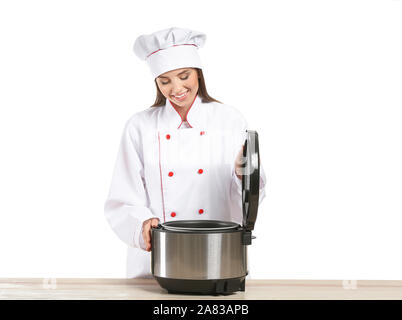 Woman using modern multi cooker in kitchen Stock Photo - Alamy