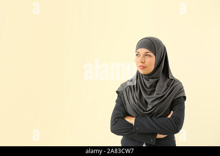Portrait of Muslim woman on light background Stock Photo