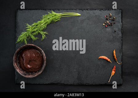 Black slate board with spices Stock Photo