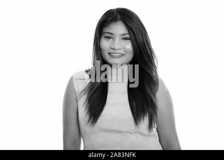 Studio shot of young happy fat Persian teenage girl smiling Stock Photo