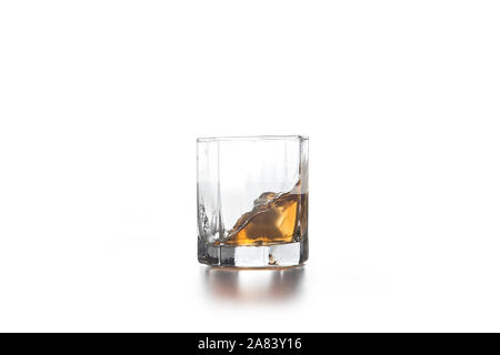 Download Whiskey Splash Out Of Glass On Yellow Background Stock Photo Alamy Yellowimages Mockups