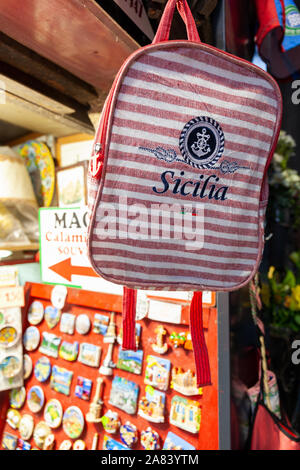 Handbag and lots of souvenirs at a gift shop in Catania, Sicily Stock Photo